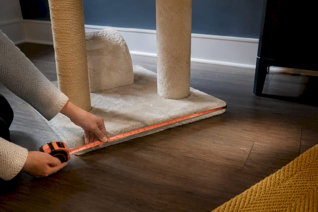 Measuring tape across cat tree base