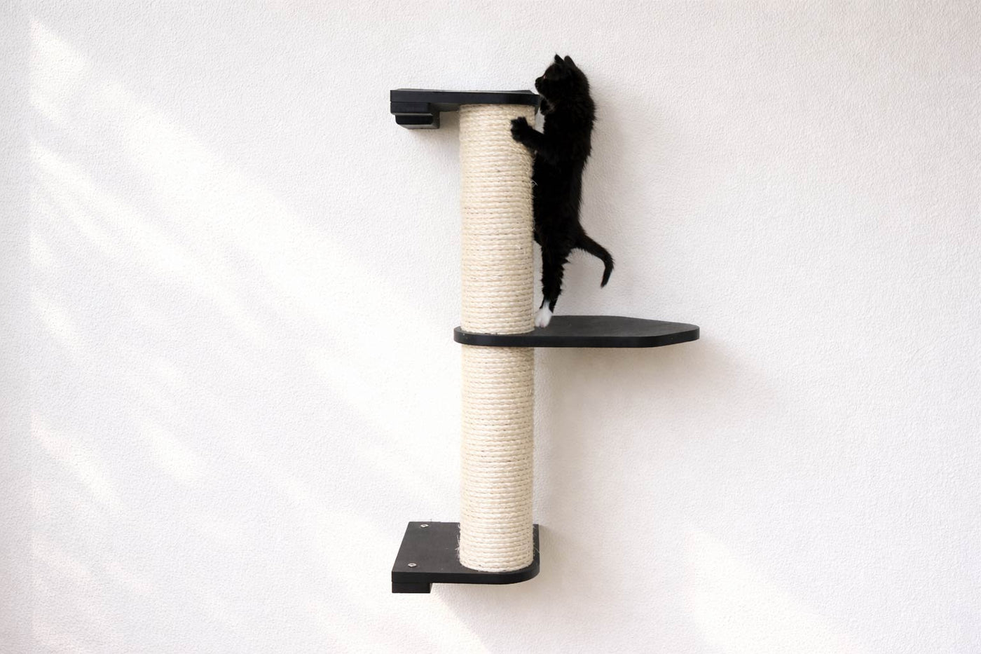 Wall mounted sisal cat scratching pole with a leaf shelf attached partway up