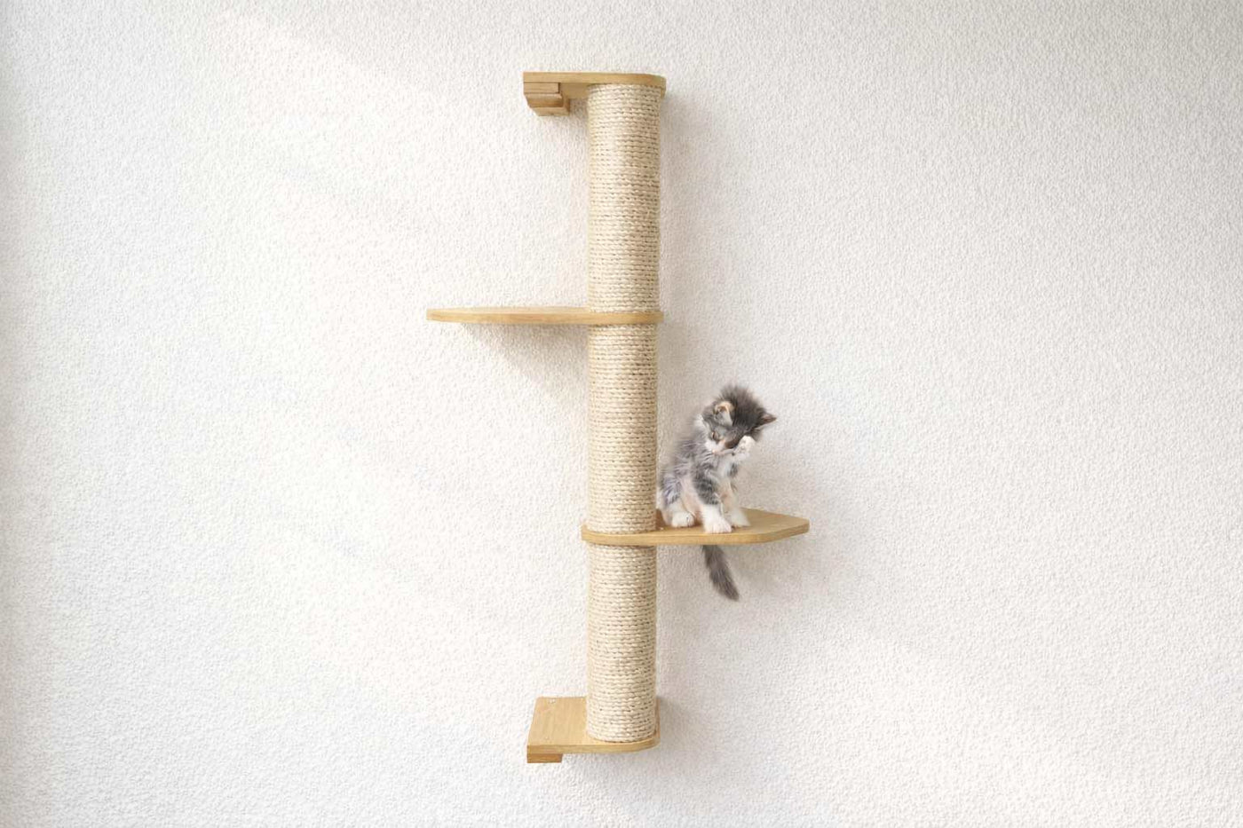 Wall mounted sisal cat scratching pole with a leaf shelf attached partway up