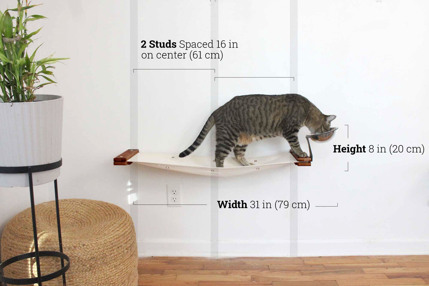 Wall mounted raised cat feeder with food dishes and an attached canvas lounge