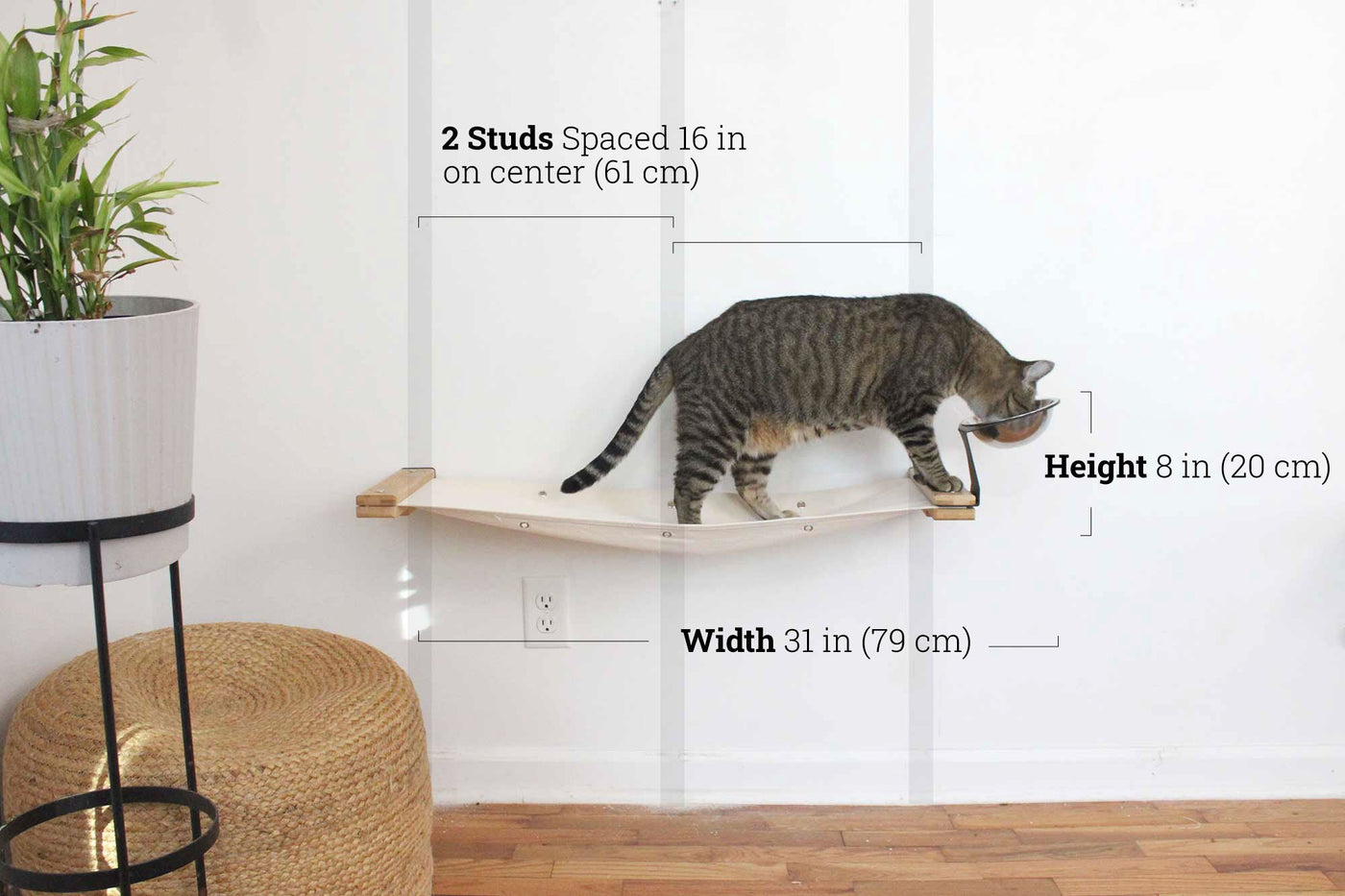 Wall mounted raised cat feeder with food dishes and an attached canvas lounge