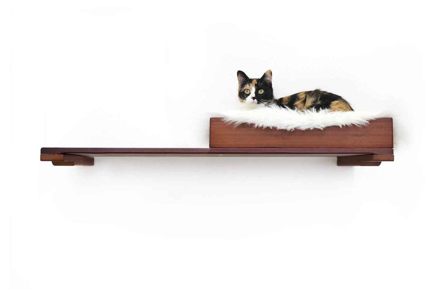 Wall-mounted bamboo cat bed with a curved front ledge and faux fur pad