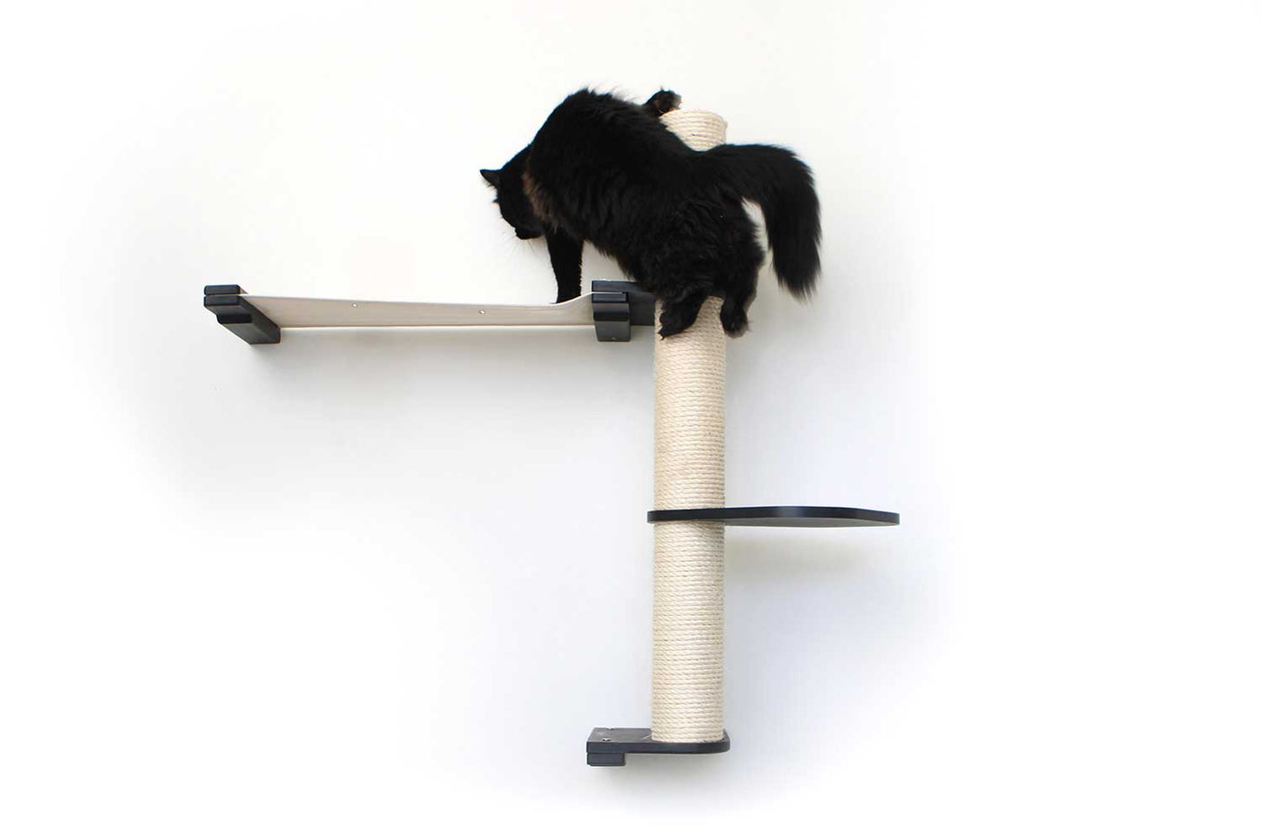 Tall wall mounted cat scratcher tree with a sisal pole installed high near the ceiling