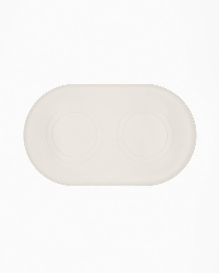 Fable Signature Bowl Mat with a raised border under a cat bowl