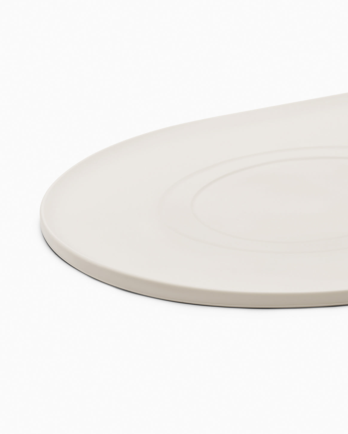 Fable Signature Bowl Mat with a raised border under a cat bowl