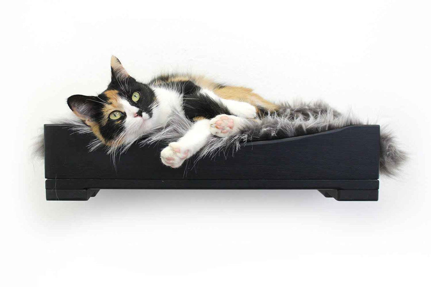 Wall-mounted bamboo cat bed with a curved front ledge and faux fur pad