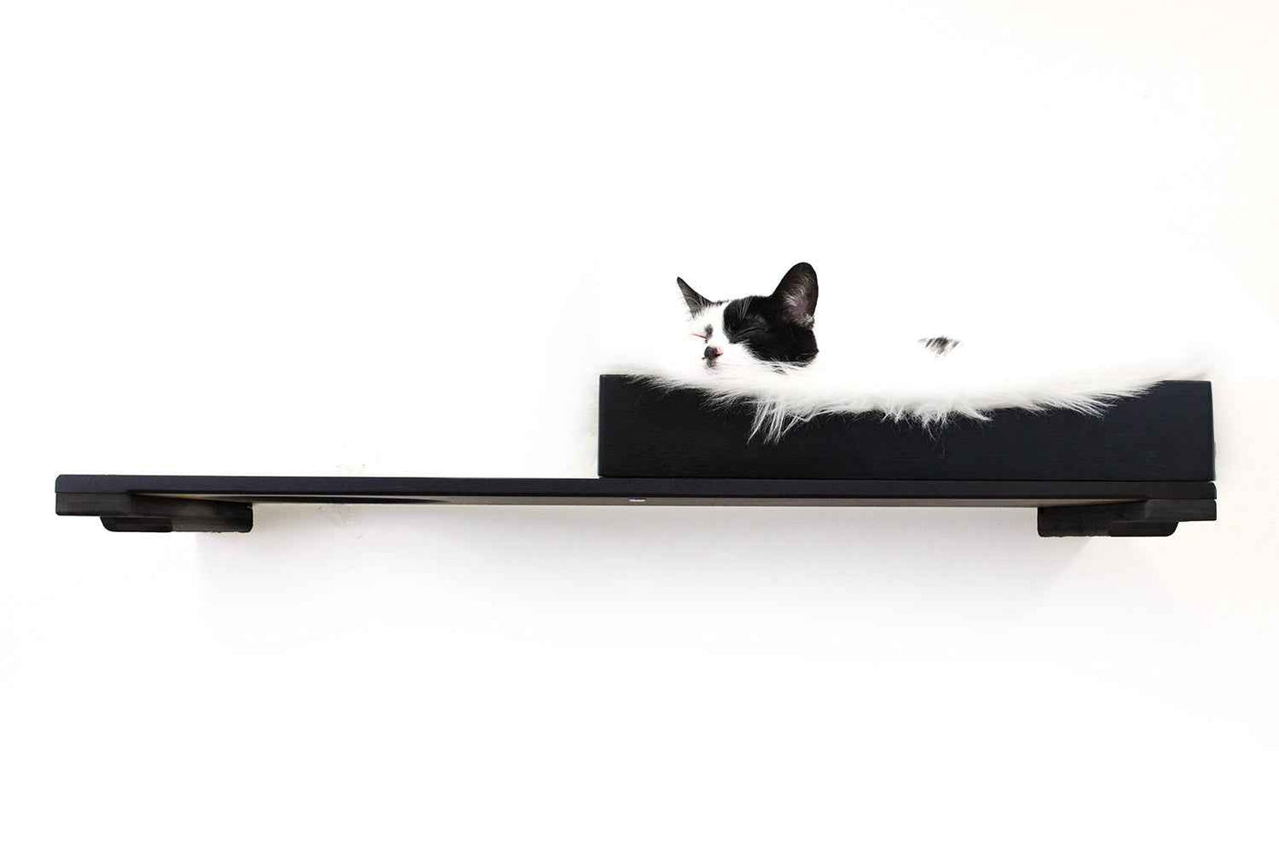 Wall-mounted bamboo cat bed with a curved front ledge and faux fur pad