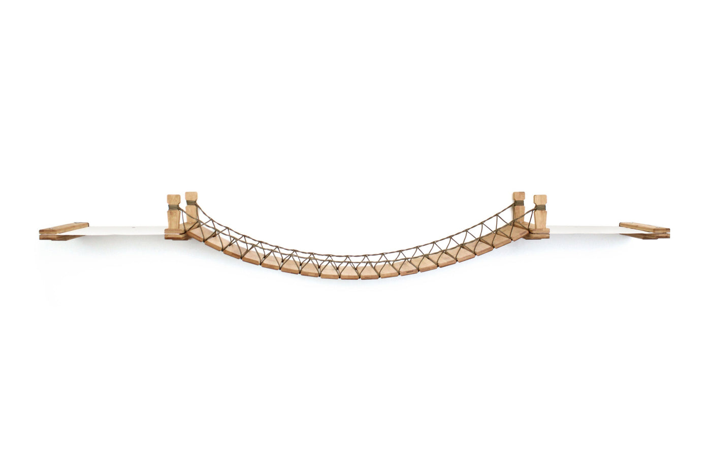 Wall mounted cat bridge with a canvas hammock at each end above a doorway
