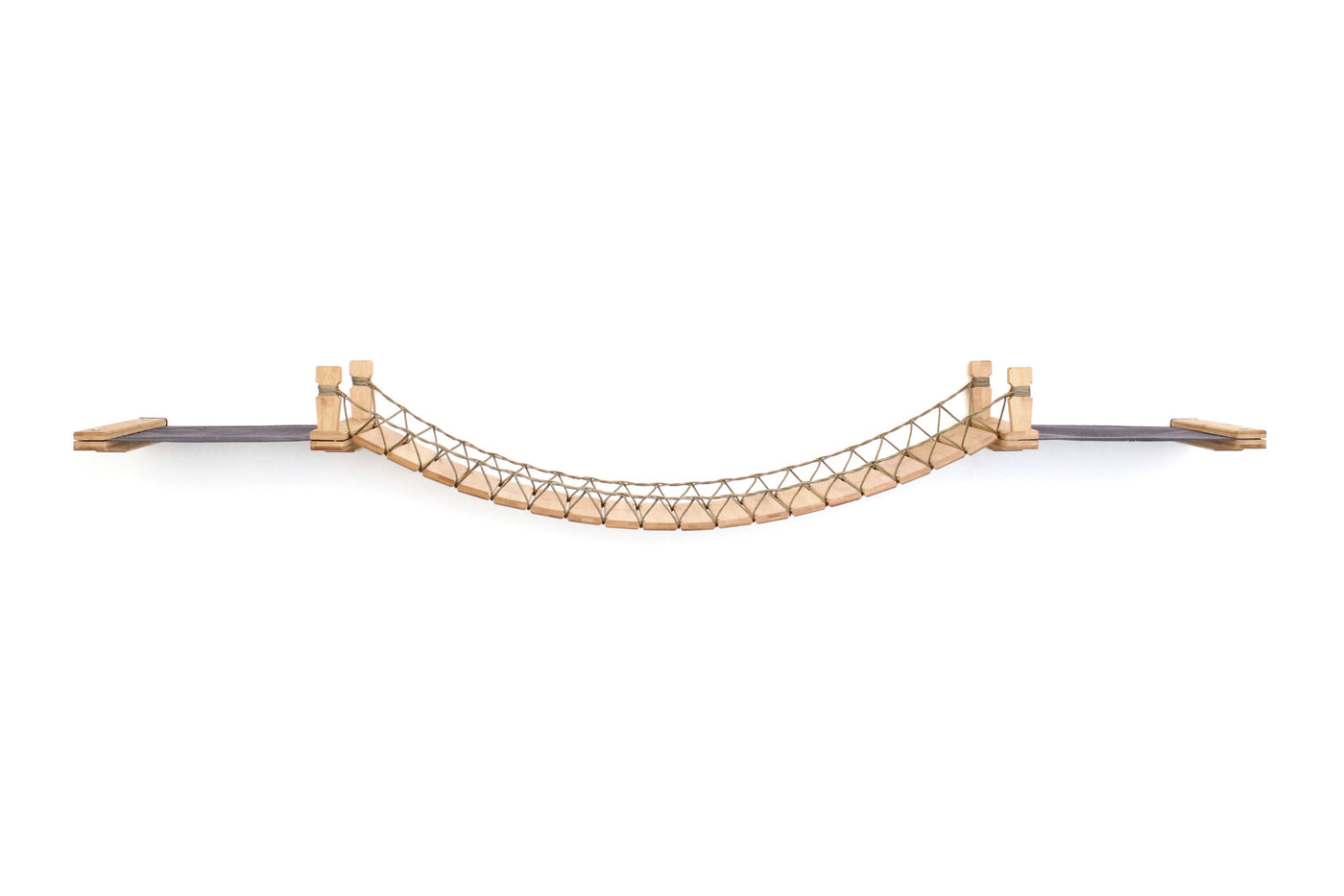 Wall mounted cat bridge with a canvas hammock at each end above a doorway