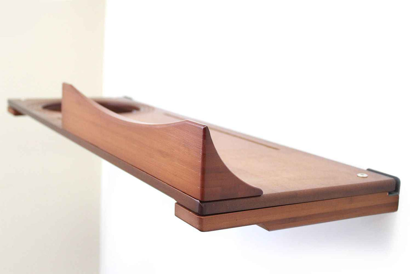 Wall-mounted bamboo cat bed with a curved front ledge and faux fur pad