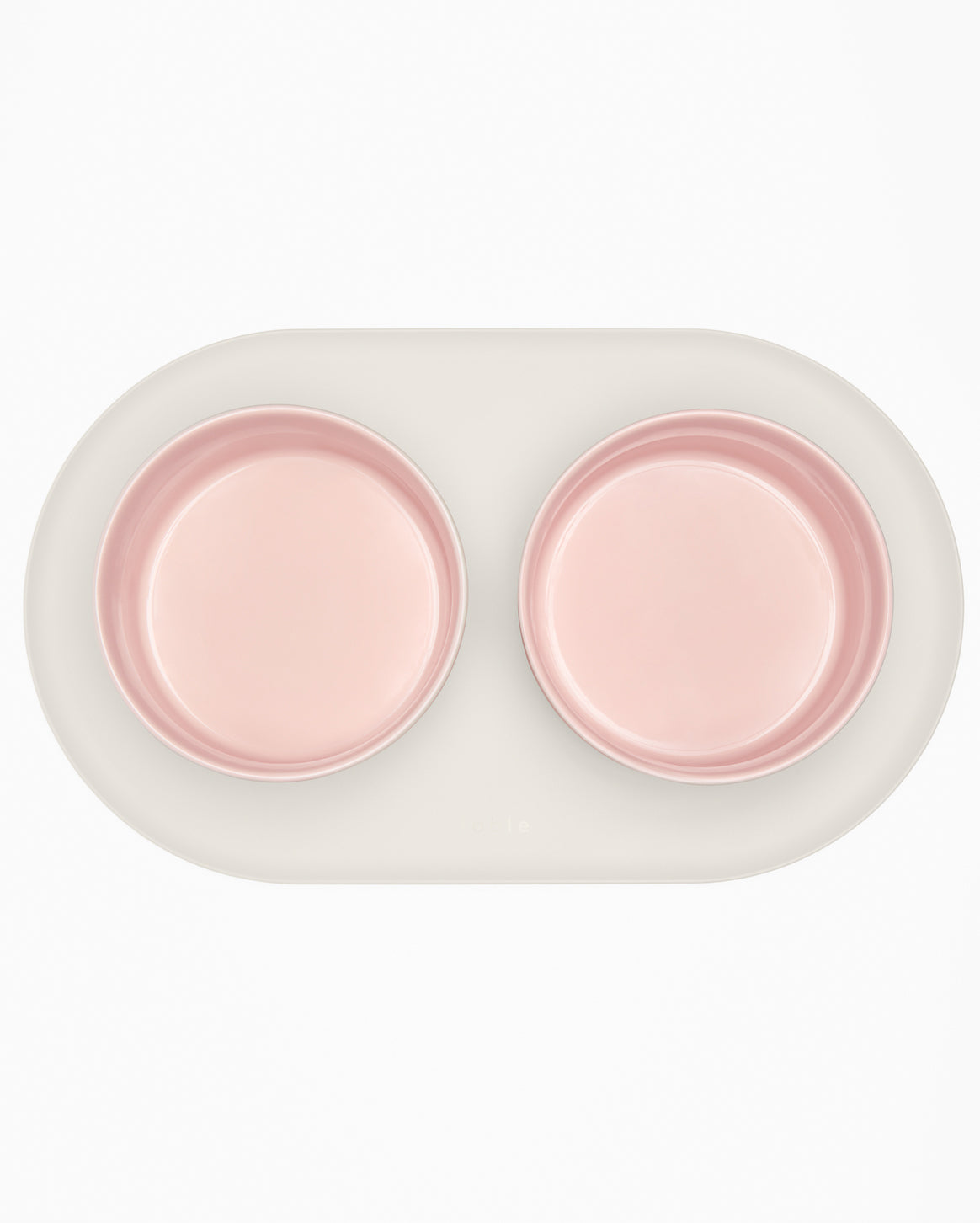 Fable Signature Bowl Mat with a raised border under a cat bowl