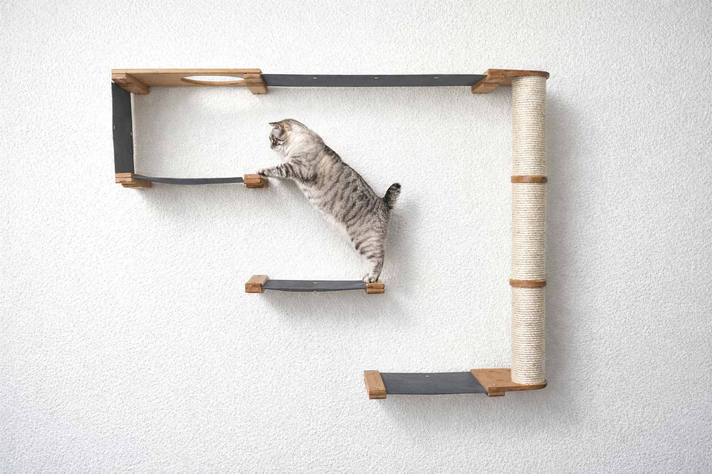 Wall mounted cat condo with a tall three-tier sisal scratching pole and stacked platforms