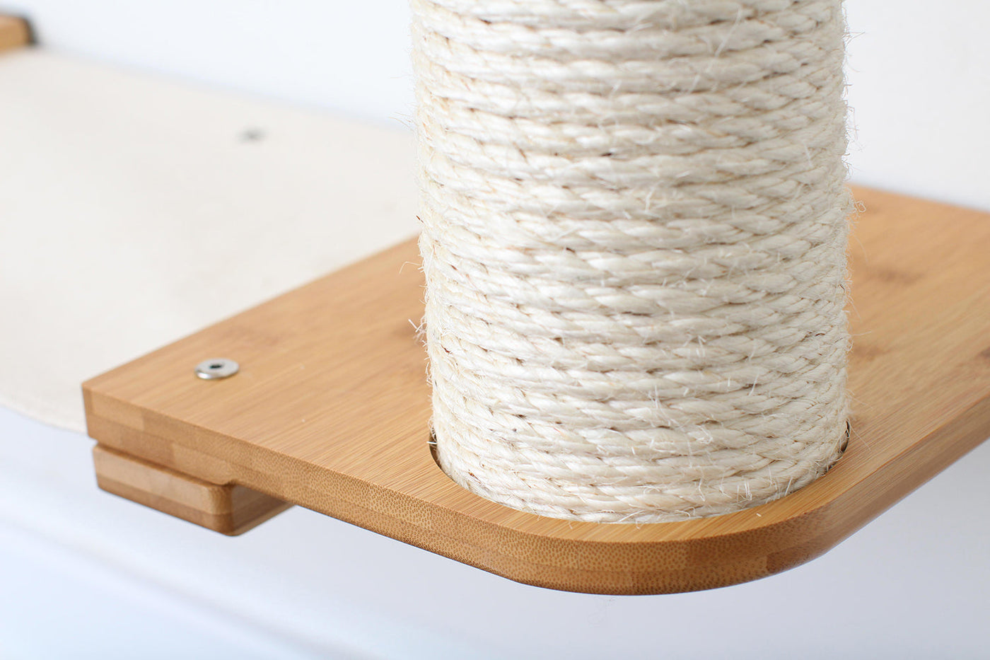 Wall mounted cat condo with a tall three-tier sisal scratching pole and stacked platforms