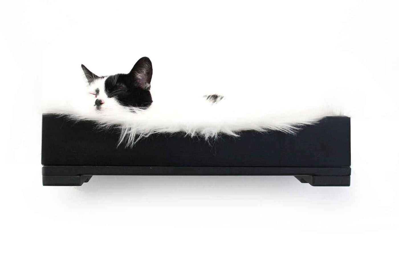 Wall-mounted bamboo cat bed with a curved front ledge and faux fur pad
