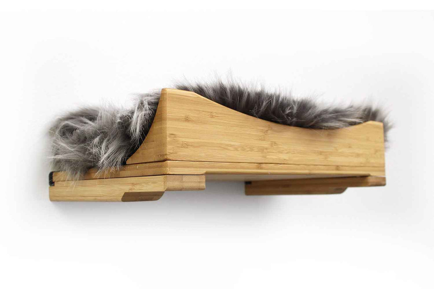 Wall-mounted bamboo cat bed with a curved front ledge and faux fur pad