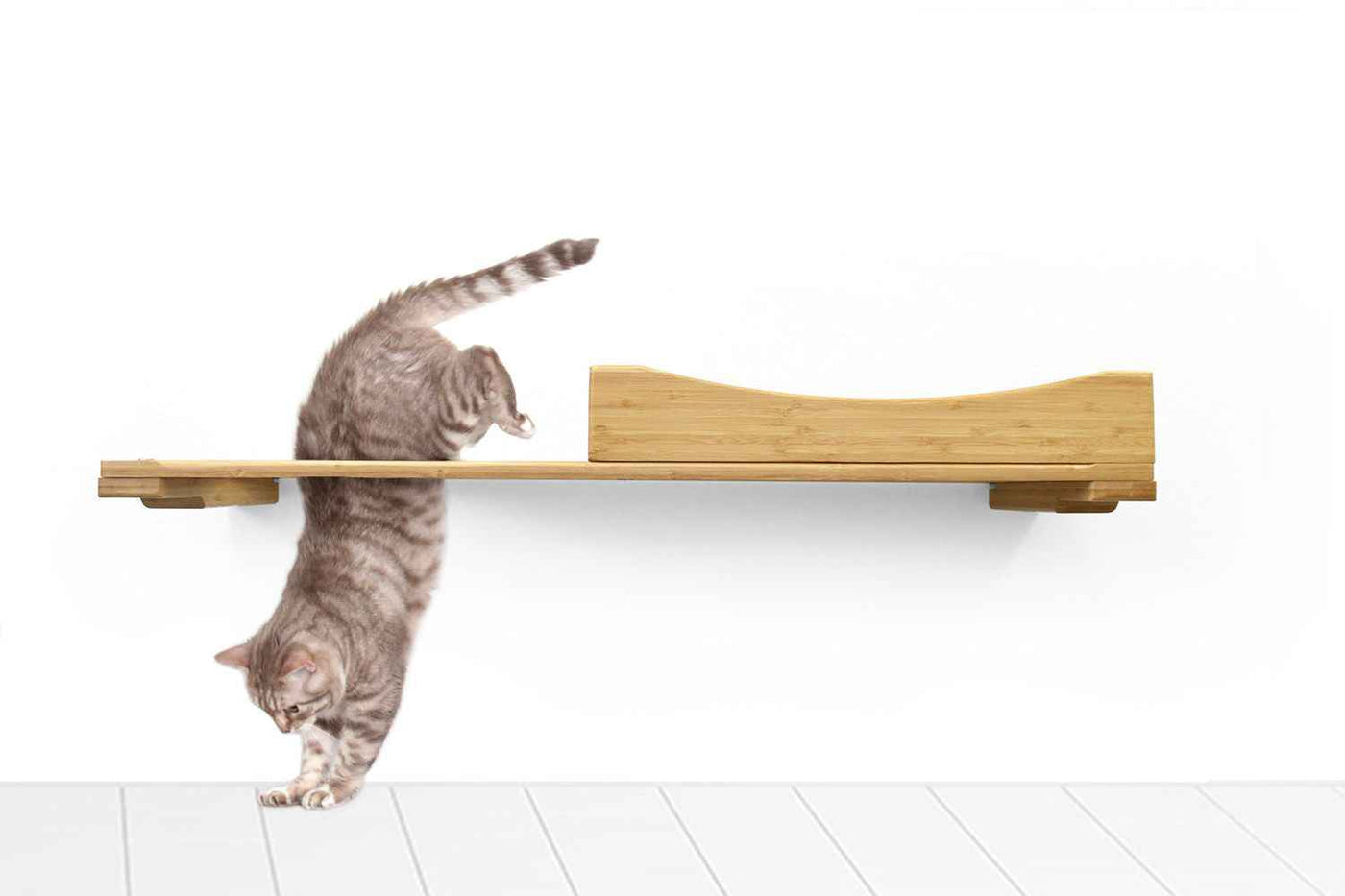 Wall-mounted bamboo cat bed with a curved front ledge and faux fur pad