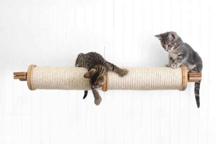 Wall mounted horizontal sisal cat scratching post running sideways across the wall
