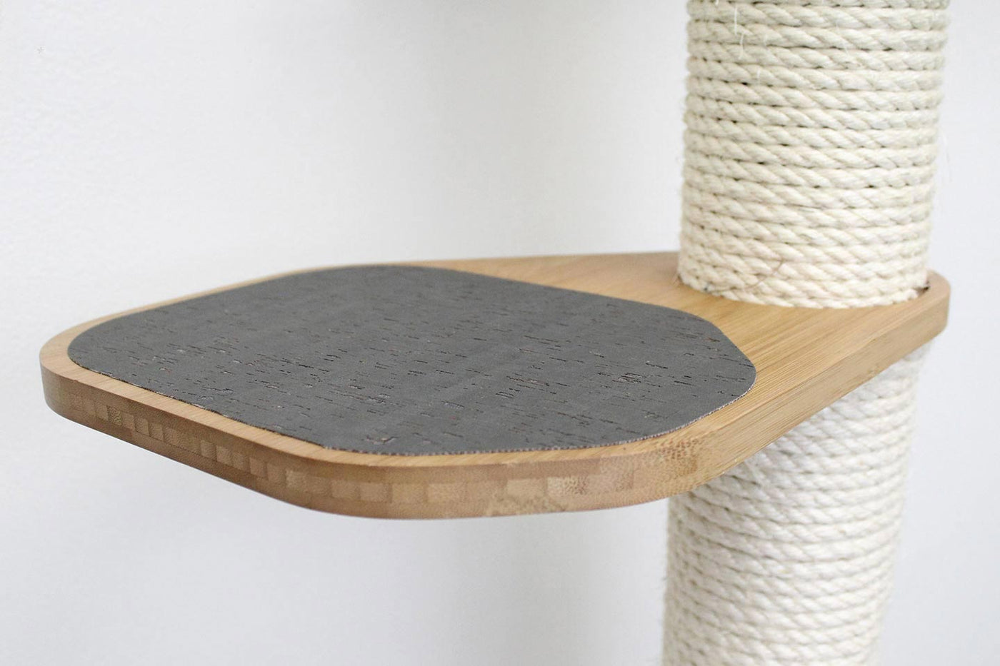 Wall mounted cat condo with a tall three-tier sisal scratching pole and stacked platforms