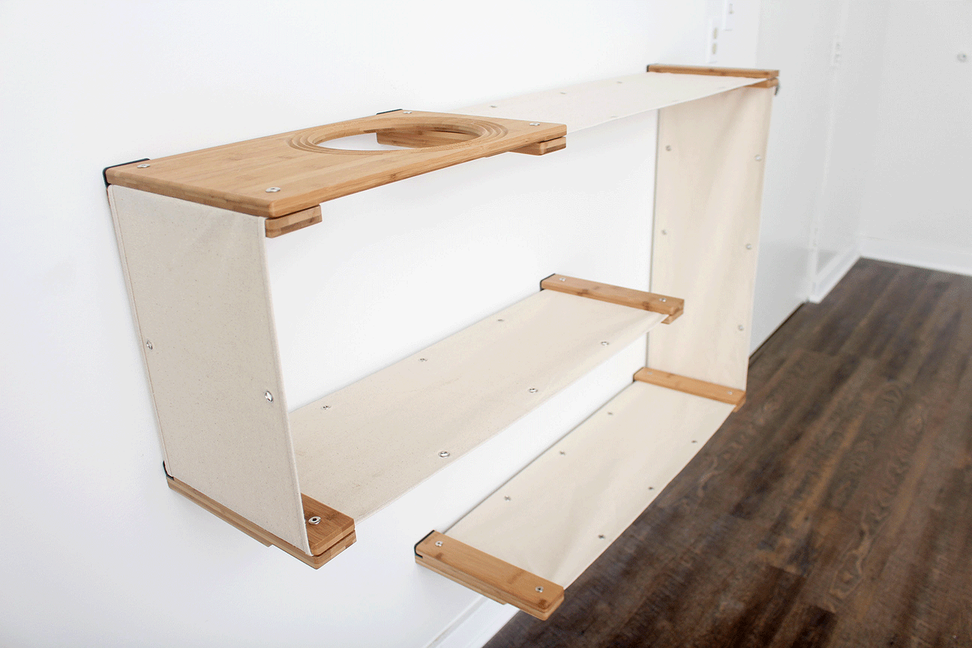 Wall mounted bamboo cat maze condo with interlocking panels and a small escape hatch opening