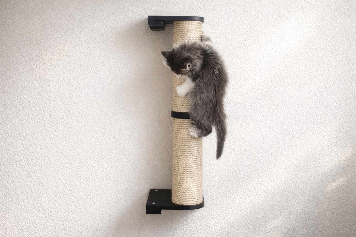 Wall mounted sisal cat scratching pole with a leaf shelf attached partway up