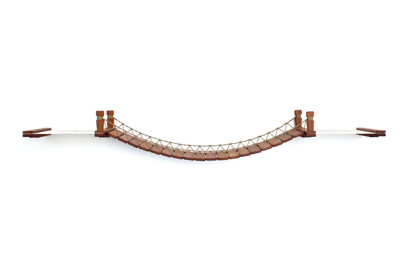 Wall mounted cat bridge with a canvas hammock at each end above a doorway